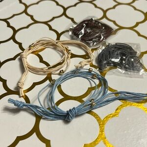 4 String bracelets with metal bead accents